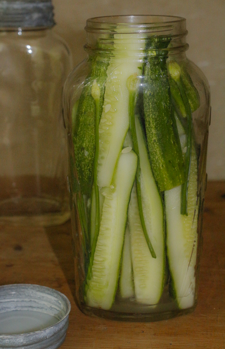 Pack in the cucumbers, then add your hot brining solution