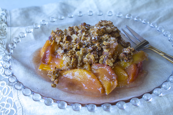 Serve the Peach Crisp with a dusting of Confectioner's Sugar... with or without Ice Cream 