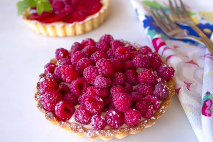 A Buttery Crust holds a Creamy Custard with loads of Fresh Raspberries