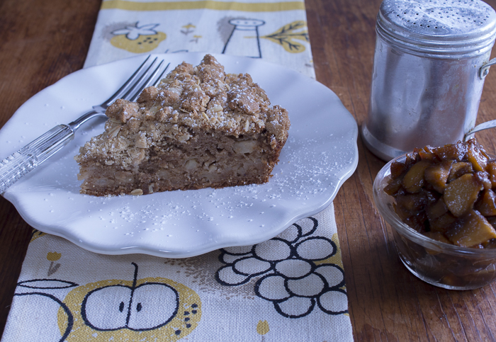 A slice of Apple Cake with the Caramelized Apples served on the side