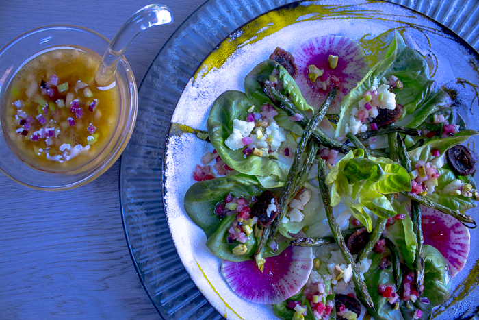 Serve the salad on individual plates with some extra Vinaigrette on the side