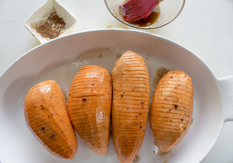 Place potatoes in a baking dish and bake, covered until softened