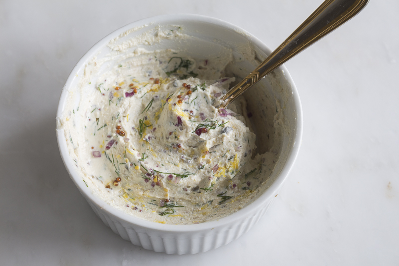 The flavored cream cheese with dill, lemon rind, grainy mustard, capers and red onion