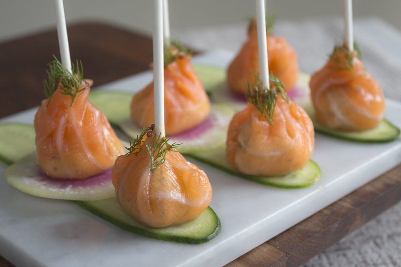 The perfect holiday appetizer - smoked salmon wrapped around a flavored cream cheese