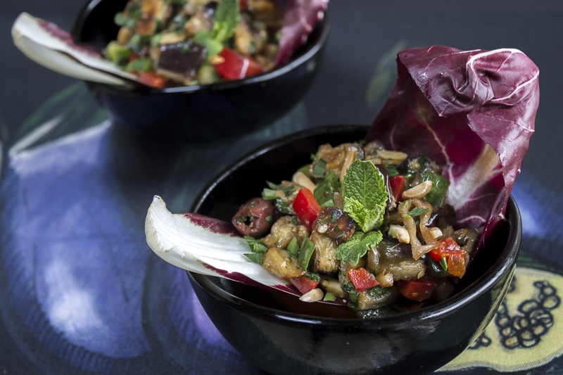 Individual servings of the Roasted Eggplant Salad with the zesty dressing