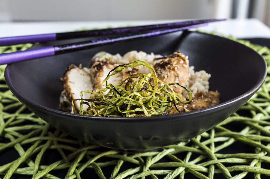 Slice the sesame coated chicken and serve with roasted zucchini over steamed brown rice