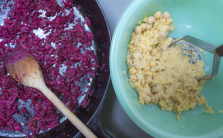 Vegetables are sautéed, chickpeas are mashed, leaving some whole