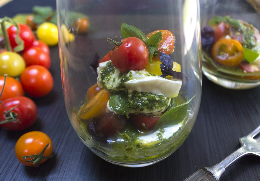 Layer creamy Burrata with ripe, colorful cherry tomatoes, basil leaves and drizzle with Pesto Vinaigrette