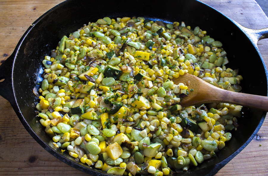Skillet Succotash with fresh corn, lima beans, butter beans, (optional) multi-colored zucchini, caramelized shallots and a touch of jalapeño.