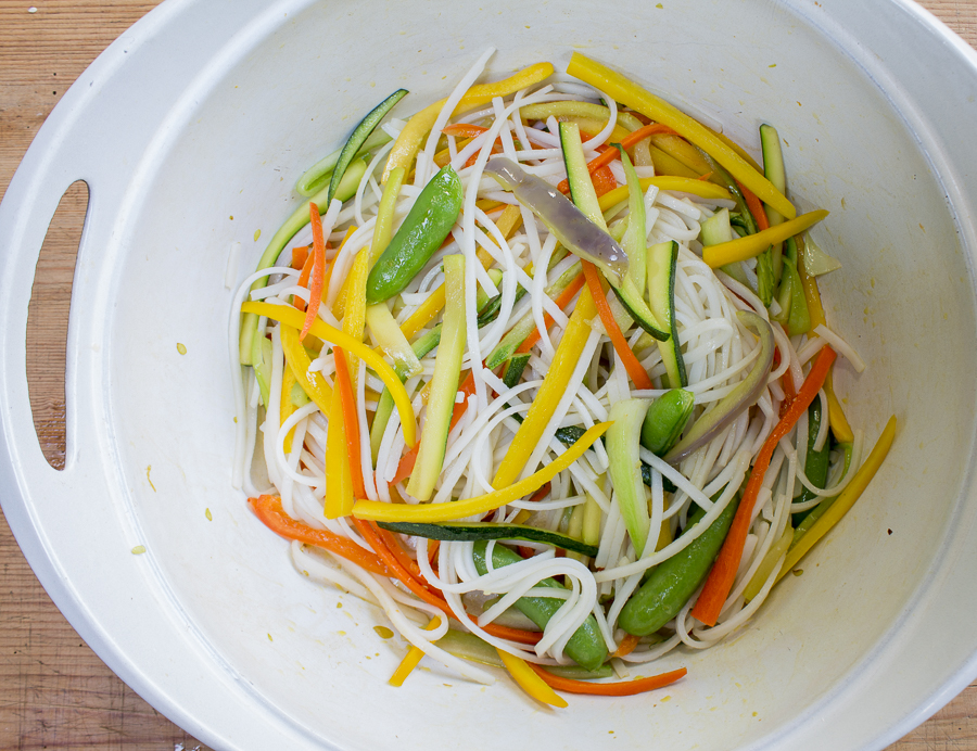 Sauteed vegetables combined with soaked rice noodles - then add the simmering sauce