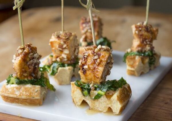 Pecan Chicken and Waffle Appetizer with Sautéed Collards and Maple-Bourbon Drizzle