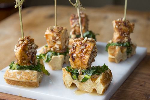The Ultimate Appetizer with Southern Charm ~ Grilled Chicken with Pecans and a Maple-Bourbon Glaze on top of crisp Buttermilk Waffles and Sweet and Sour Sautéed Collard Greens