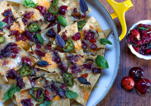 Layer the cherry salsa with the tortilla chips and cheeses and bake