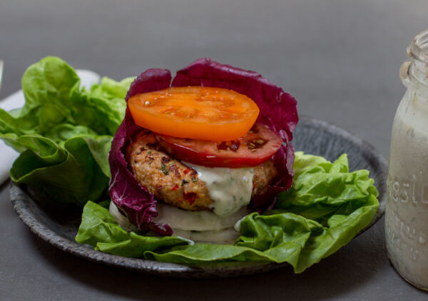 The Ultimate Grilled Burger Wrapped in Lettuces with Onion and Heirloom Tomatoes ~ Homemade Ranch Dressing.