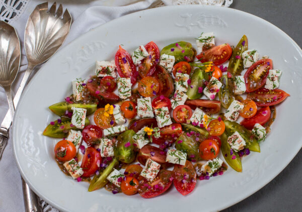 Heirloom Tomatoes ~ Bite-Sized, Team up with Creamy French Feta Cubes with a Zesty Vinaigrette for a Simple Summer Salad