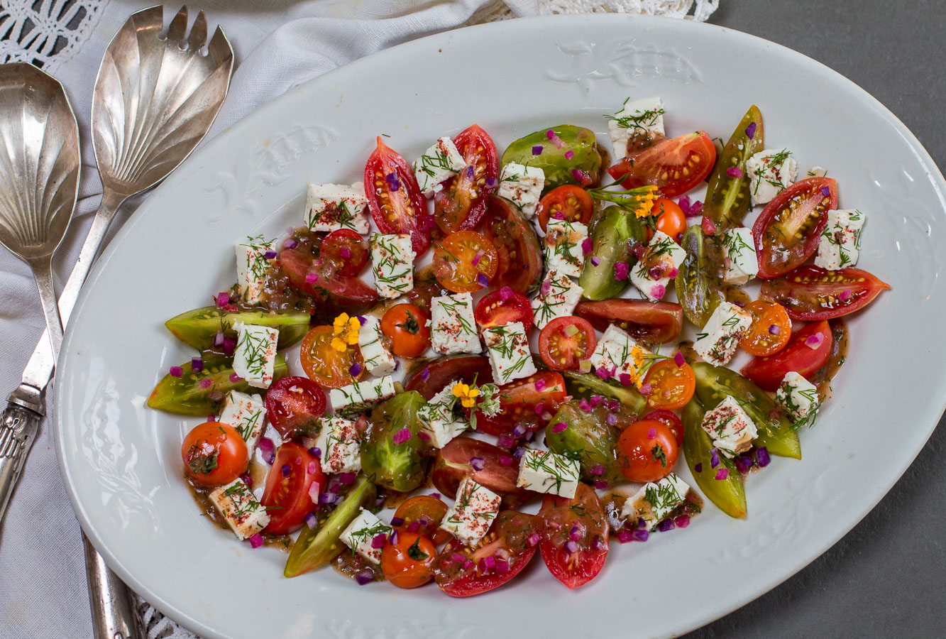 Heirloom Tomatoes ~ Bite-Sized, Team up with Creamy French Feta Cubes with a Zesty Vinaigrette for a Simple Summer Salad