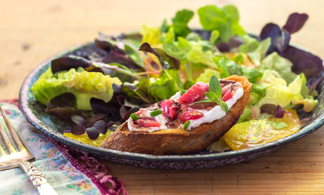 Rhubarb and Goat Cheese Bruschetta over a salad with Rhubarb & Shallot Vinaigrette