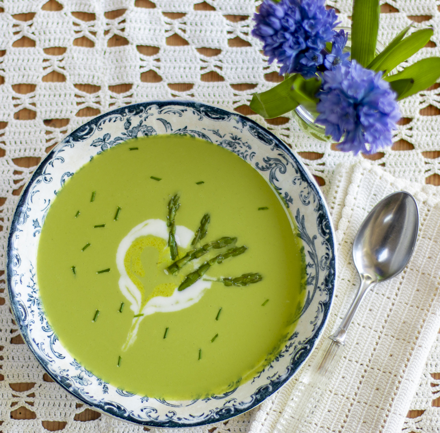 Spring Asparagus Soup – Vegan – with Cashew Crema Swirl in a vintage blue & white bowl 