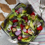 Summer Strawberry Salad with Walnuts, Feta and Maple-Walnut Vinaigrette in a square bowl