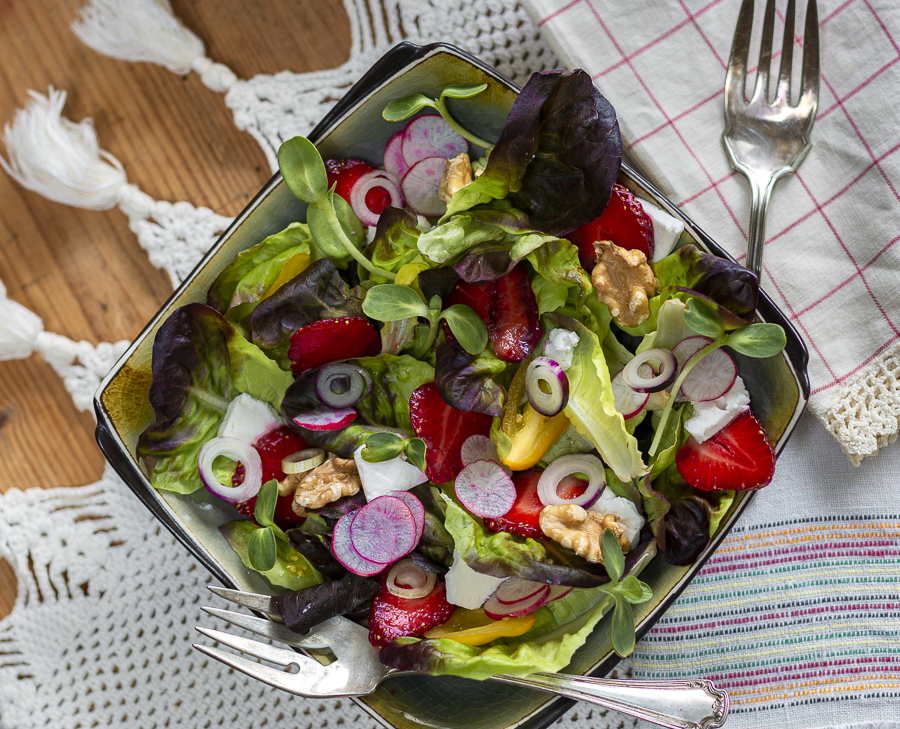 Summer Strawberry Salad with Walnuts, Feta and Maple-Walnut Vinaigrette in a square bowl 