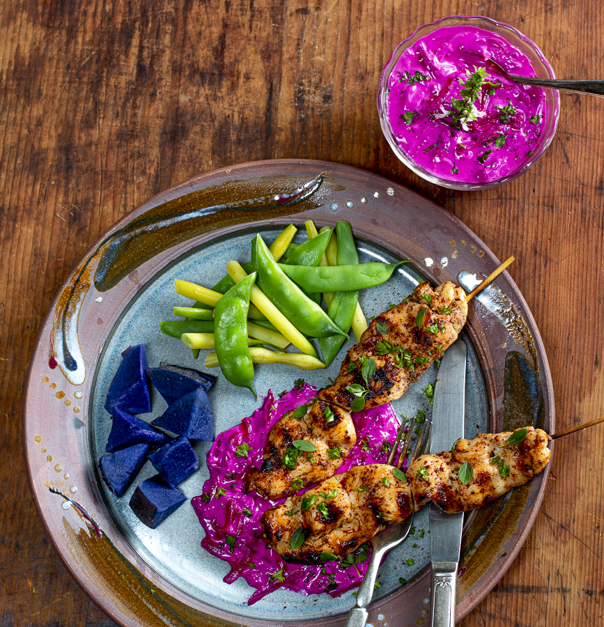 Beet Tzatziki with Spiced Chicken Skewers on a vintage plate