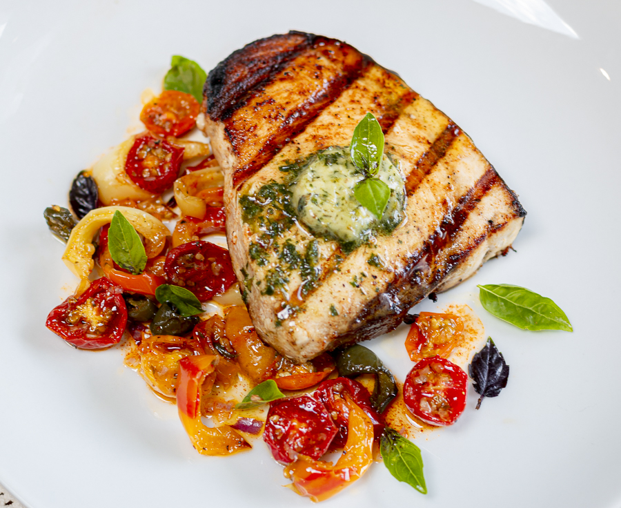 Pesto Compound Butter over Grilled Swordfish with Slow-Roasted Heirloom Tomatoes & Peppers