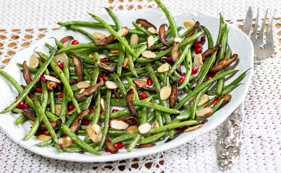 Haricot Vert with Garlic, Almonds, Pomegranate Seeds and Shiitake “Bacon” with Za’atar Seasoning on a vintage platter