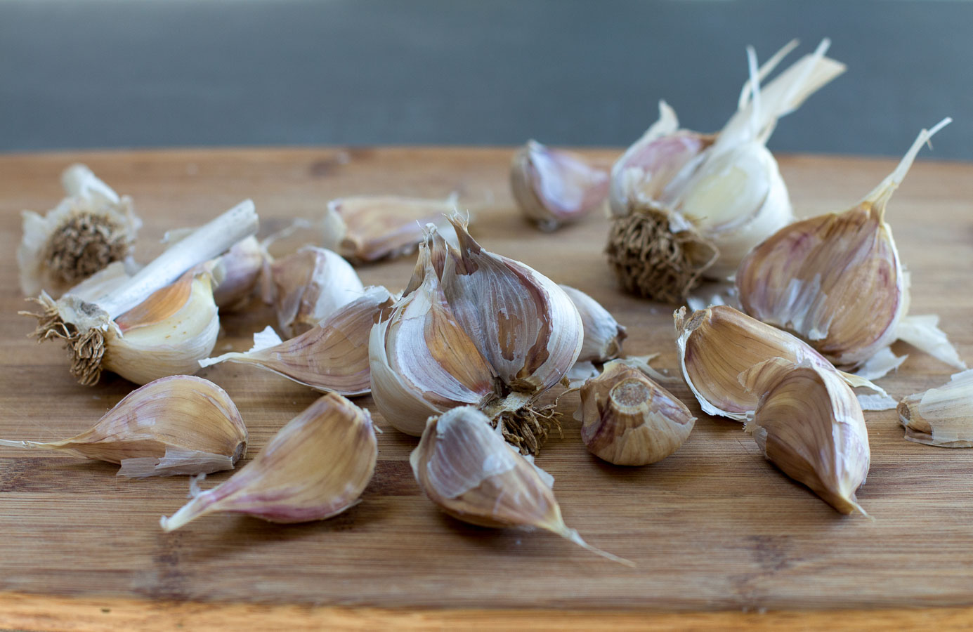Separate the cloves from four heads of garlic