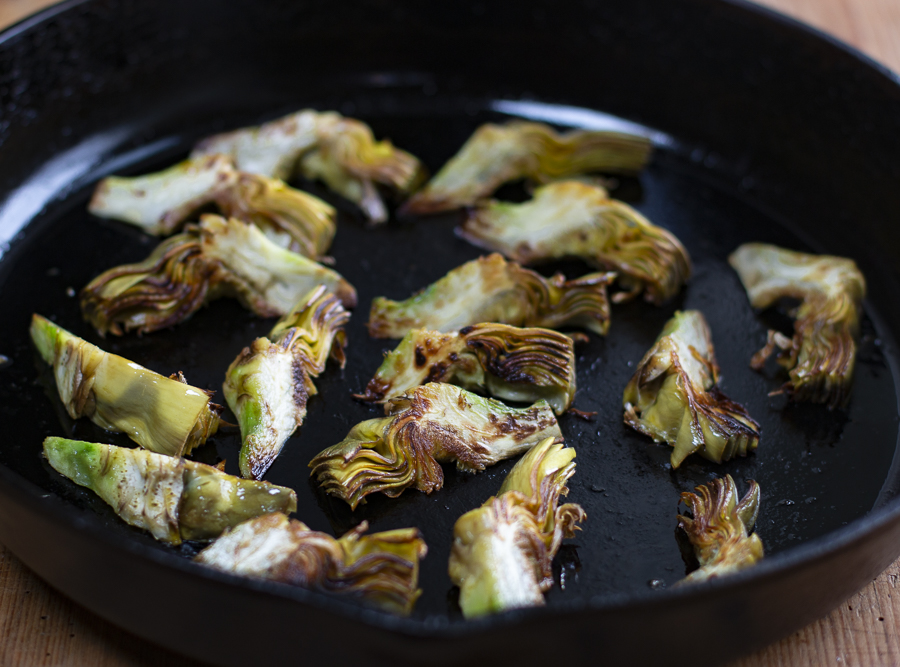 Lightly Brown Artichoke quarters in a little EVOO