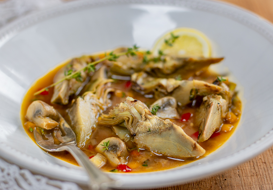 Artichokes à la Grecque in a white bowl 