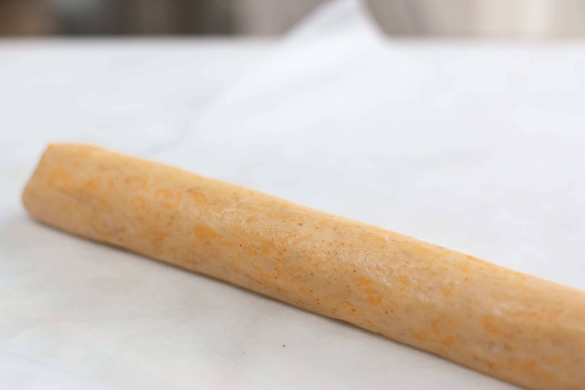 Using waxed paper – roll the dough into a log and refrigerate until cold and hardened