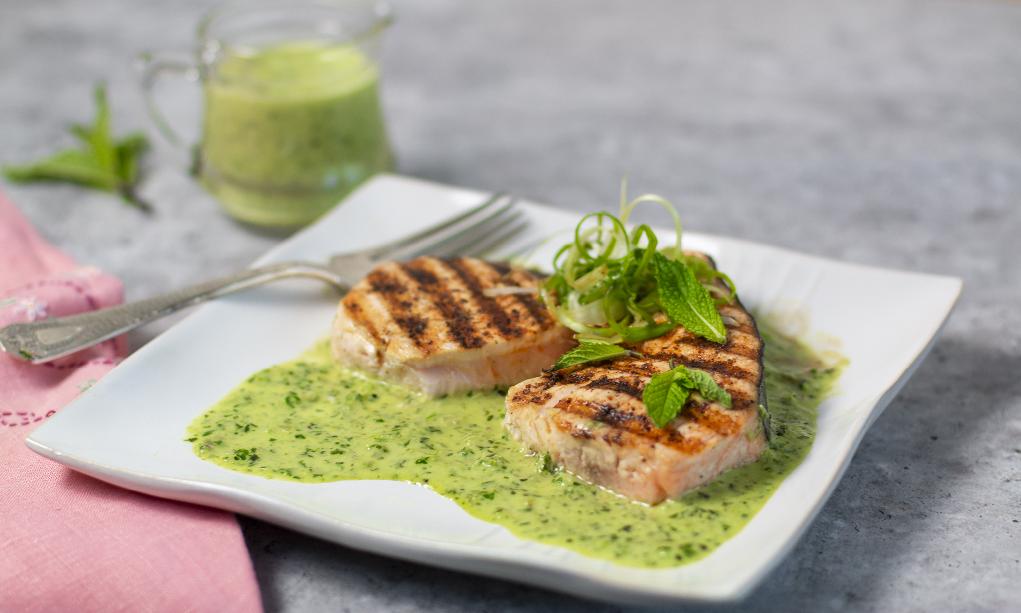 Grilled Pumpkin Swordfish with Green Masala Sauce on a square plate