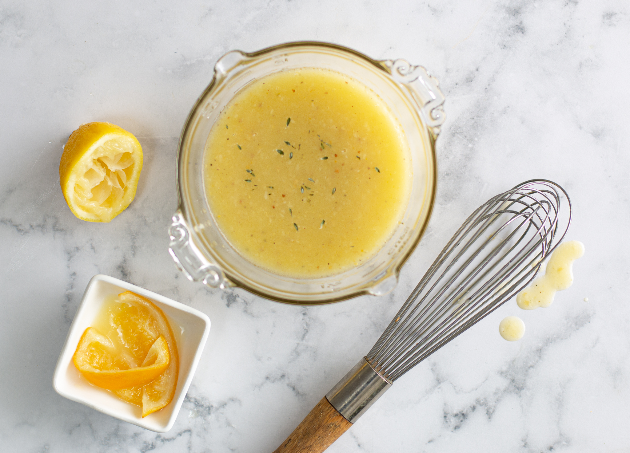 Preserved Lemon Vinaigrette with cut lemons and whisk