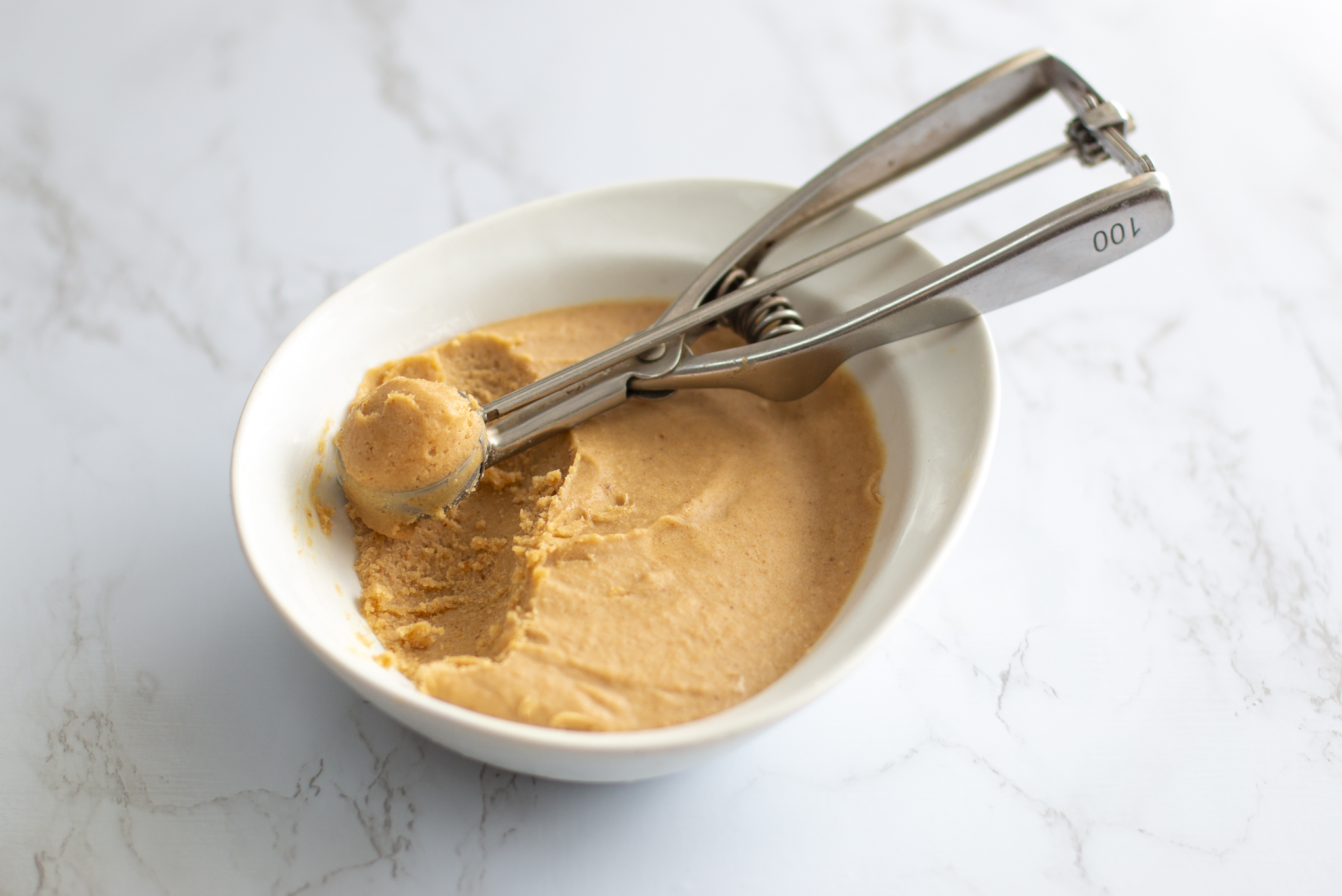 peanut butter truffles besing scooped