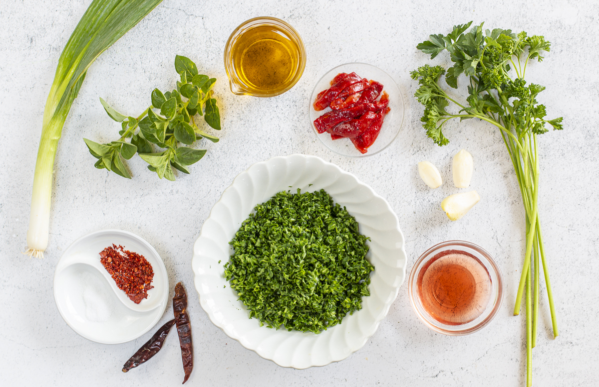 Simple ingredients for the Chimichurri Sauce on a marble board 