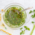 Chimichurri sauce in a vintage glass bowl