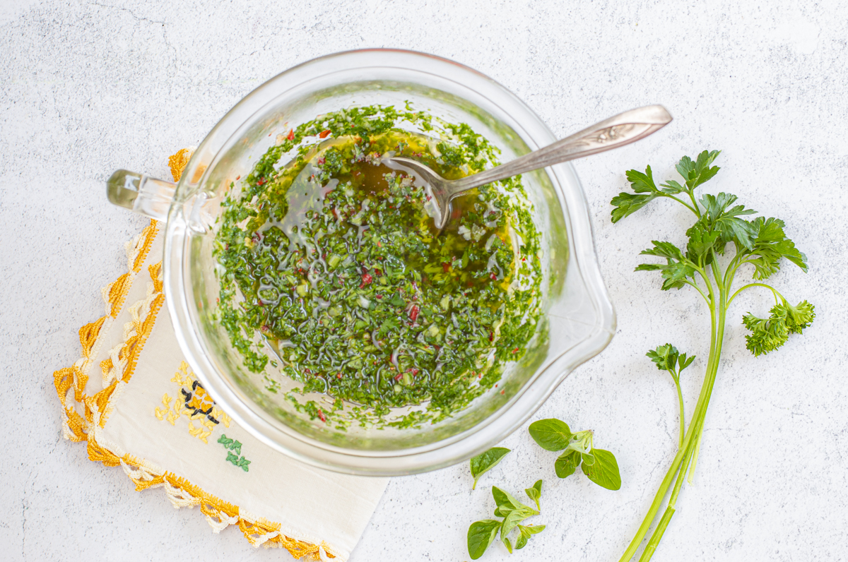 Chimichurri sauce in a vintage glass bowl