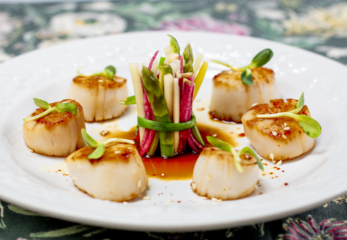 Seared Scallops with Karen's Ponzu Sauce on white embossed plate