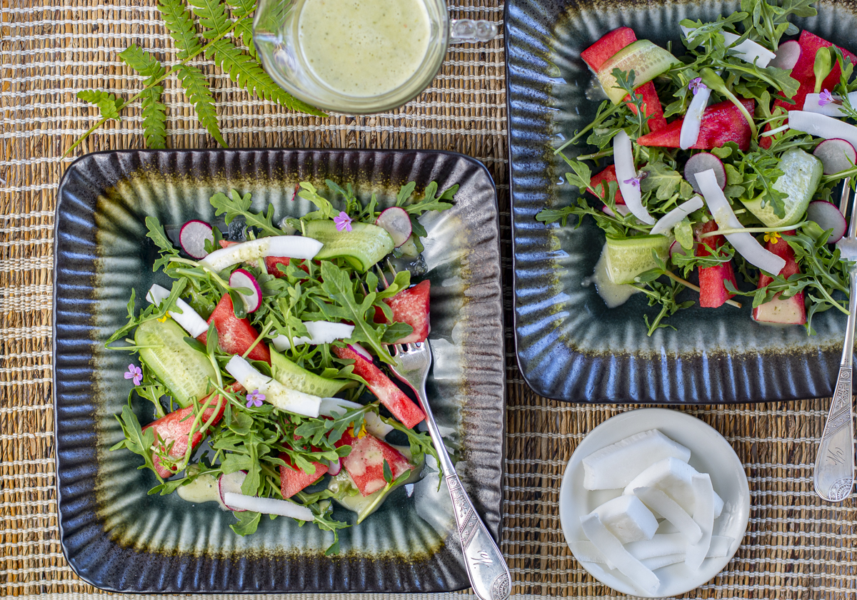 Watermelon & Coconut Salad with Thai Dressing on two square plates
