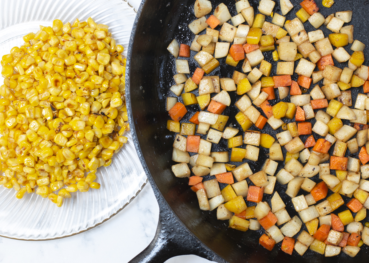 Cook corn first in the cast iron skillet until golden and "pops" than add remaining vegetables and cook until tender-crisp