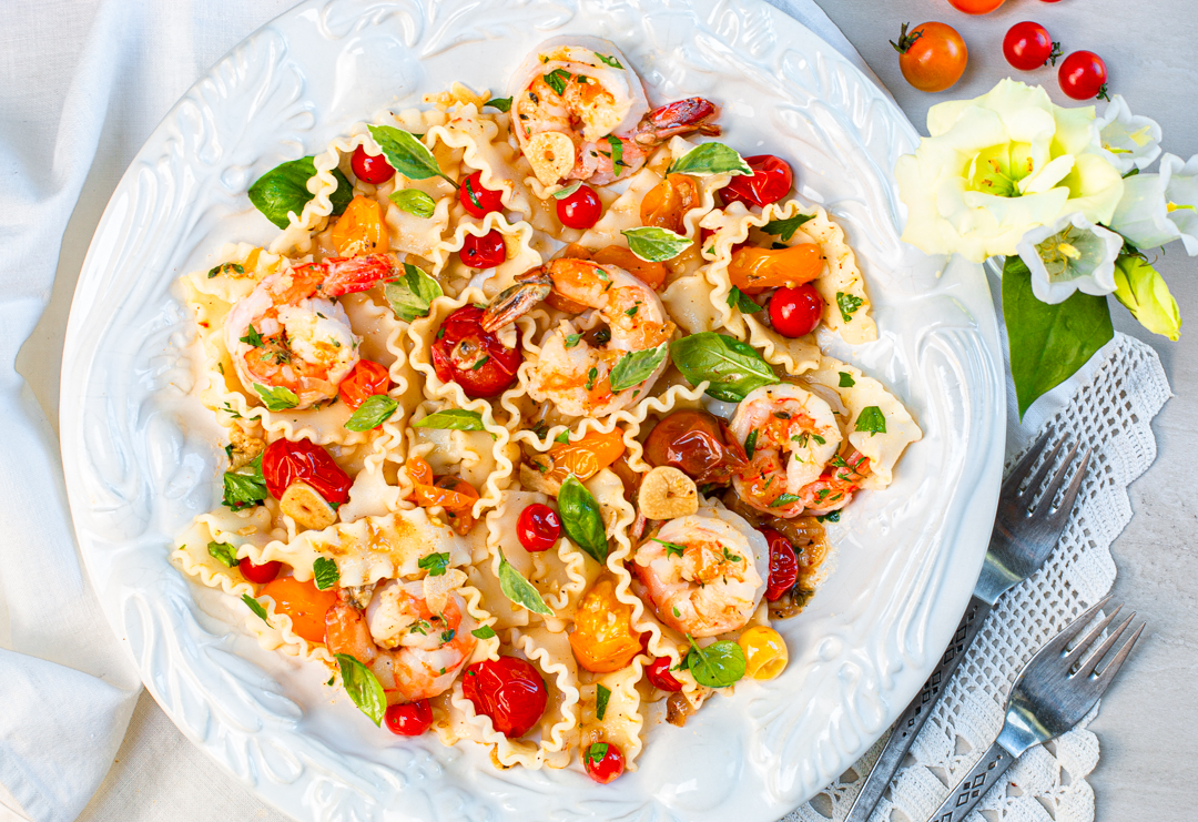 Burst Heirloom tomatoes over Pasta with Shrimp in vintage bowl