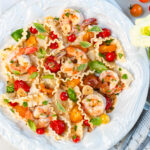 Burst Heirloom Tomatoes Over Pasta with Shrimp in vintage bowl