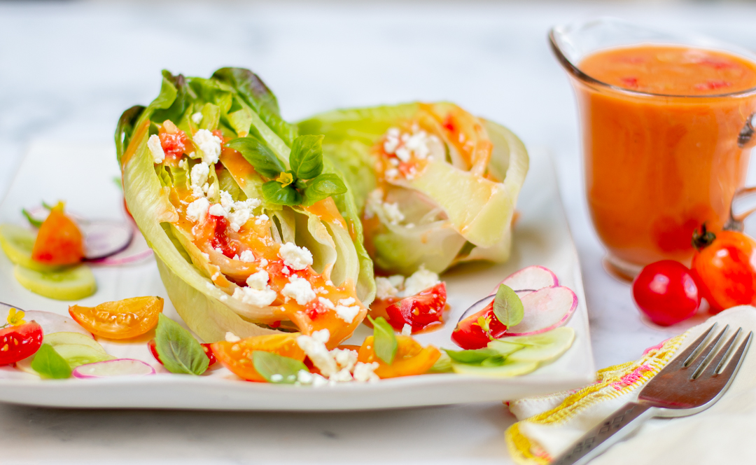 Top the lettuce hearts with Tomato Vinaigrette and sprinkle with feta cheese 