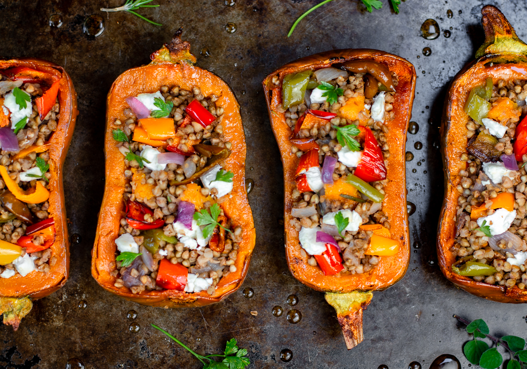 The Honeynut Squash Halves are stuffed with the Kasha Pilaf and dabs of goat cheese and a good sprinkling of parsley 