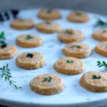 Cheddar and Herb “Pennies” ~ Savory Shortbread Crackers on a marble platter
