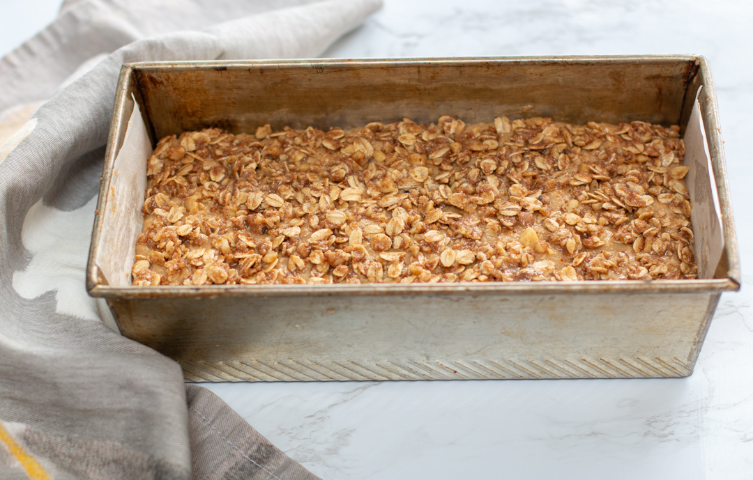 Ready to bake the applesauce loaf cake! The oat-streusel topping on top is gently pressed in 