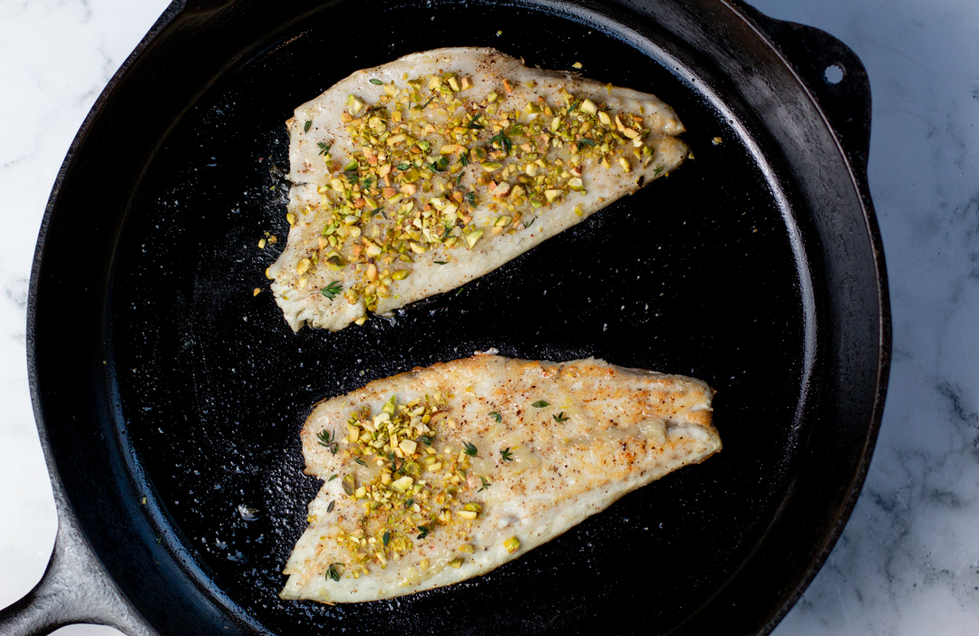 Pistachio Crusted Branzino in a cast iron pan - done in minutes!