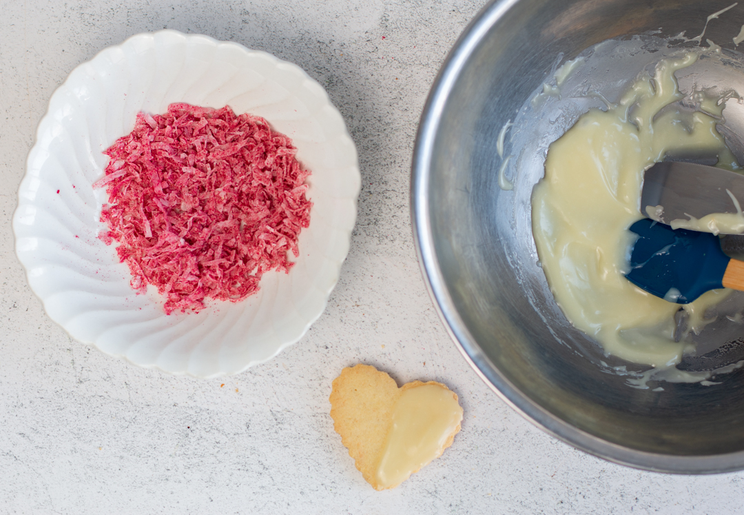 Frost the Sable cookies with a White Chocolate Glaze on half, top with Raspberry Coconut mixture 