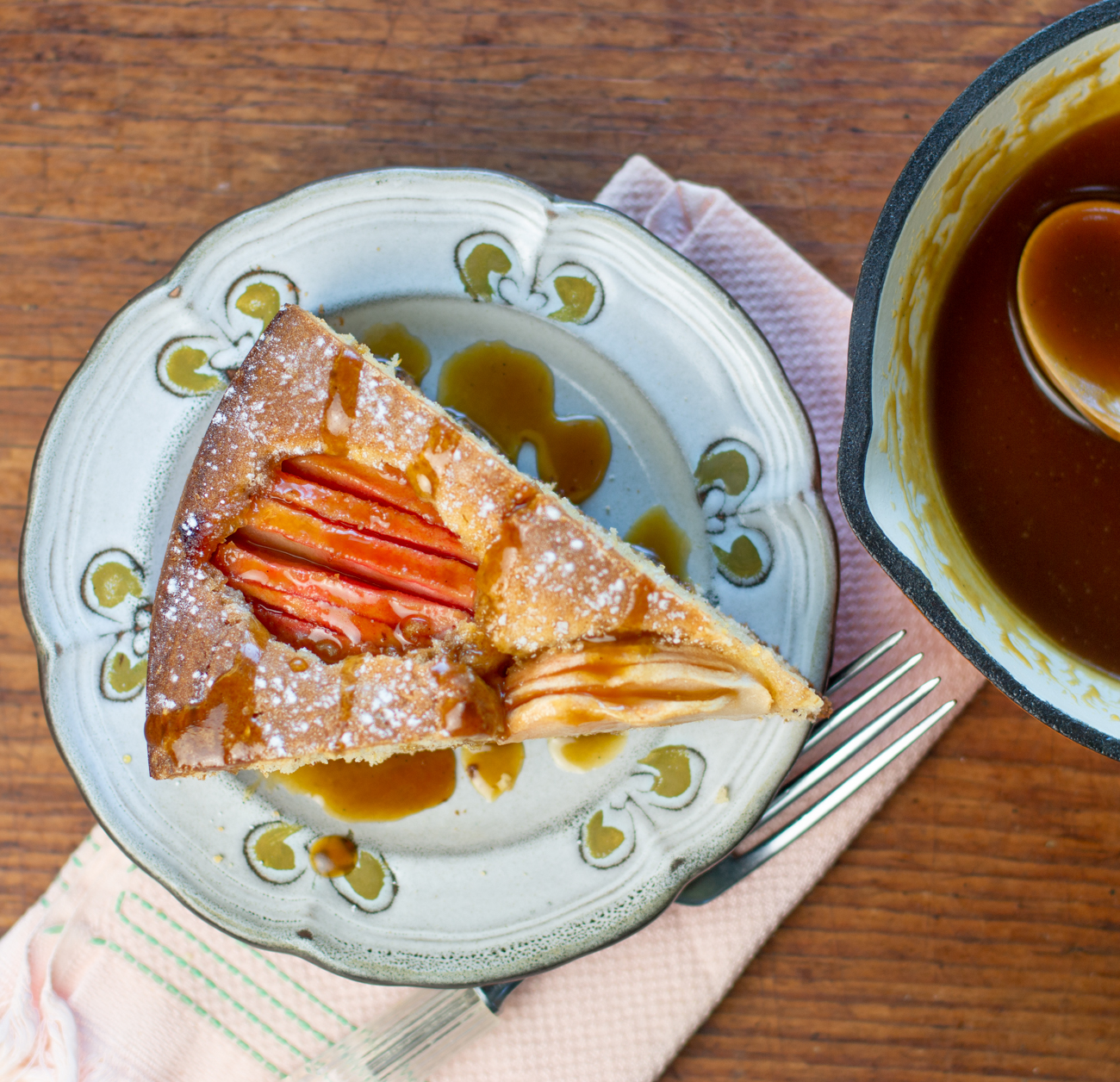 One slice of Karen's German Apple Cake with Pink Pearl Apples topped with Maple Caramel Sauce 