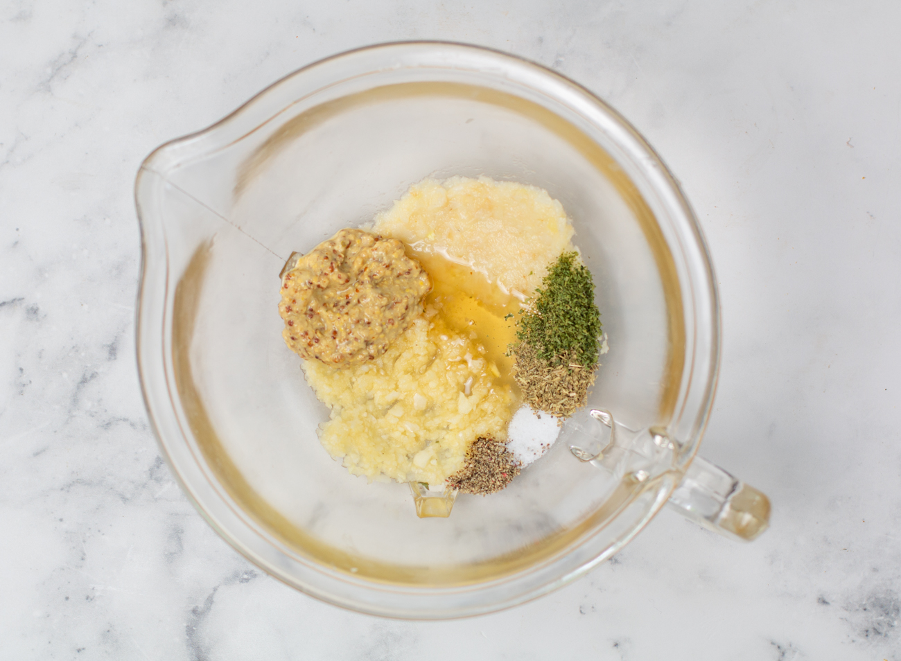 First Step - and flavoring ingredients in a medium sized bowl for the Garlic-Garlic Vinaigrette